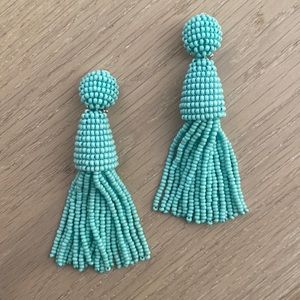 Turquoise tassel clip on earrings.